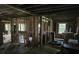 Unfinished living room showcasing exposed beams, natural light from windows, and an open layout ready for renovation at 436 W Butternut Rd, Summerville, SC 29483
