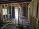 Exposed framing and studs in an unfinished room showing its potential for a personalized layout and design at 436 W Butternut Rd, Summerville, SC 29483