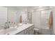 Bright bathroom featuring a white vanity, framed mirror, and a shower/tub combination at 538 Richfield Way, Summerville, SC 29486