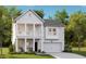 Charming two-story home with white siding, a double porch, and an attached garage at 538 Richfield Way, Summerville, SC 29486