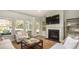 Comfortable living room with fireplace, large windows, and an open concept layout at 538 Richfield Way, Summerville, SC 29486
