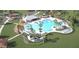 Stunning community pool with ample seating, palm trees, and a nearby playground at 538 Richfield Way, Summerville, SC 29486