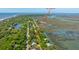 Aerial view displaying the home's location near the beach, waterways, and road, 607 Jungle Rd at 607 Jungle Rd, Edisto Beach, SC 29438