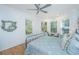 Comfortable bedroom has multiple windows, hardwood floors, and a decorative mirror at 607 Jungle Rd, Edisto Beach, SC 29438