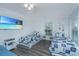This coastal bedroom features two twin beds, wood-look floors, and a flat-screen television at 607 Jungle Rd, Edisto Beach, SC 29438