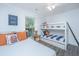 Comfortable bedroom with a twin bed, bunk beds, luxury vinyl floors, and lots of light at 607 Jungle Rd, Edisto Beach, SC 29438