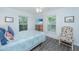 This bright bedroom features coastal decor, a ceiling fan, and luxury vinyl floors at 607 Jungle Rd, Edisto Beach, SC 29438