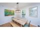 Bright dining room with wooden table and bench, perfect for Gathering meals at 607 Jungle Rd, Edisto Beach, SC 29438
