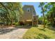 Exterior elevation featuring an elevated stilt house, and long driveway at 607 Jungle Rd, Edisto Beach, SC 29438
