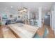Open-concept living and dining area with bar seating and ample space for entertaining at 607 Jungle Rd, Edisto Beach, SC 29438