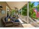 Inviting porch with comfortable wicker seating perfect for enjoying outdoor living at 607 Jungle Rd, Edisto Beach, SC 29438