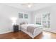 Bedroom features a serene space with hardwood floors and lots of natural light at 700 Daniel Ellis Dr # 4107, Charleston, SC 29412