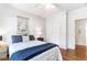 Bedroom with hardwood floors, closet, ceiling fan, and view to en-suite bathroom at 700 Daniel Ellis Dr # 4107, Charleston, SC 29412