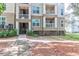Three-story condo building showcasing balconies and well-maintained landscaping at 700 Daniel Ellis Dr # 4107, Charleston, SC 29412