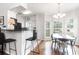 Bright kitchen and dining area with hardwood floors and large windows at 700 Daniel Ellis Dr # 4107, Charleston, SC 29412