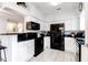 Modern kitchen featuring white cabinets and stainless steel black appliances at 700 Daniel Ellis Dr # 4107, Charleston, SC 29412