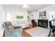 Cozy living room with fireplace and large windows offering plenty of natural light at 700 Daniel Ellis Dr # 4107, Charleston, SC 29412