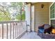 Cozy patio with chair and plant stand, offering a view of the surrounding greenery at 700 Daniel Ellis Dr # 4107, Charleston, SC 29412