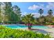 Gorgeous community pool features palm trees and ample lounge seating for relaxation and recreation at 700 Daniel Ellis Dr # 4107, Charleston, SC 29412