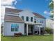 Spacious backyard with a pergola, outdoor seating, and a grill, perfect for entertaining at 8009 Indian Hill Dr, Hanahan, SC 29410