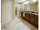 Bathroom featuring double vanity with dark wood cabinets and tiled floors at 8009 Indian Hill Dr, Hanahan, SC 29410