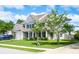 Charming two-story home with a well-manicured lawn, inviting front porch and attached garage at 8009 Indian Hill Dr, Hanahan, SC 29410