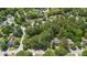 Aerial view of residential homes with lush greenery and mature trees in a suburban setting at 8661 Laurel Grove Ln, North Charleston, SC 29420
