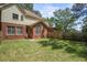 Large backyard features a brick exterior, a fenced in yard, and a well-maintained lawn at 8661 Laurel Grove Ln, North Charleston, SC 29420