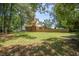 Spacious backyard with a well-maintained lawn and privacy fence, perfect for outdoor activities at 8661 Laurel Grove Ln, North Charleston, SC 29420