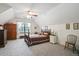 Bedroom has a comfortable bed and an abundance of natural light coming in from the window at 8661 Laurel Grove Ln, North Charleston, SC 29420