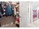 Spacious walk-in closet and access to a large bathroom with a red-toned tub at 8661 Laurel Grove Ln, North Charleston, SC 29420