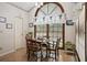 Cozy dining area with a large arched window offering natural light and a view at 8661 Laurel Grove Ln, North Charleston, SC 29420