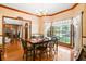 Sun-lit dining area with hardwood floors and large window at 8661 Laurel Grove Ln, North Charleston, SC 29420