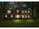 Charming two-story brick home with a manicured lawn, showcasing exterior elegance and curb appeal at 8661 Laurel Grove Ln, North Charleston, SC 29420