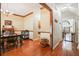 Open hallway shows dining room, laundry area, and hardwood floors at 8661 Laurel Grove Ln, North Charleston, SC 29420