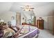 Spacious bedroom with a wooden bed, dresser, and natural light from the window at 8661 Laurel Grove Ln, North Charleston, SC 29420