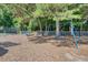 Community playground featuring swings and seesaws, perfect for outdoor activities and enjoyment at 8661 Laurel Grove Ln, North Charleston, SC 29420