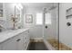Bright bathroom featuring double sink vanity with marble countertop and glass-enclosed shower at 912 Kincade Dr Dr, Mount Pleasant, SC 29464
