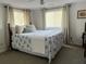 Comfortable bedroom with a decorative bedspread and natural light at 912 Kincade Dr Dr, Mount Pleasant, SC 29464