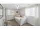 Bright bedroom featuring a bed and chair with natural light from two windows at 912 Kincade Dr Dr, Mount Pleasant, SC 29464