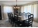 Formal dining room with seating for twelve and modern lighting fixtures at 912 Kincade Dr Dr, Mount Pleasant, SC 29464