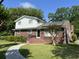 Charming two-story brick home featuring white siding, a landscaped yard, and a welcoming front entrance at 912 Kincade Dr Dr, Mount Pleasant, SC 29464