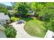 Backyard with lawn, patio, seating, mature trees, outdoor structure with ladder and slide at 1001 Foxcroft Rd, James Island, SC 29412