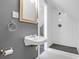 Bathroom with a white sink and a walk-in shower with white subway tile at 1001 Foxcroft Rd, James Island, SC 29412