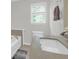 Bathroom featuring tile flooring, soaking tub, and modern vanity with a stone countertop at 1001 Foxcroft Rd, James Island, SC 29412