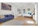 Bright bedroom with vaulted ceilings, cozy blue sofa, and natural light from large windows at 1001 Foxcroft Rd, James Island, SC 29412