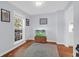Serene bedroom with a large window, natural light and hardwood floors, offering a cozy retreat at 1001 Foxcroft Rd, James Island, SC 29412