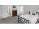 Bright bedroom featuring a bed, dresser, and attached bathroom with a shower at 1001 Foxcroft Rd, James Island, SC 29412