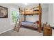 Bedroom with natural light, featuring wooden bunk beds adorned with colorful flags and a ladder at 1001 Foxcroft Rd, James Island, SC 29412