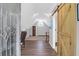 Spacious bonus room with wood floors, neutral walls, round window, and wood barn door at 1001 Foxcroft Rd, James Island, SC 29412